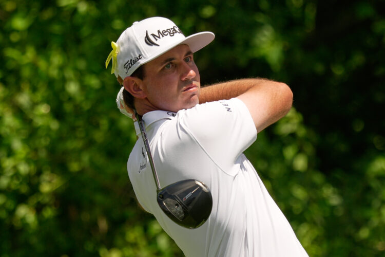 J.T. Poston handles the wind at Memorial for low round of tournament and the lead
